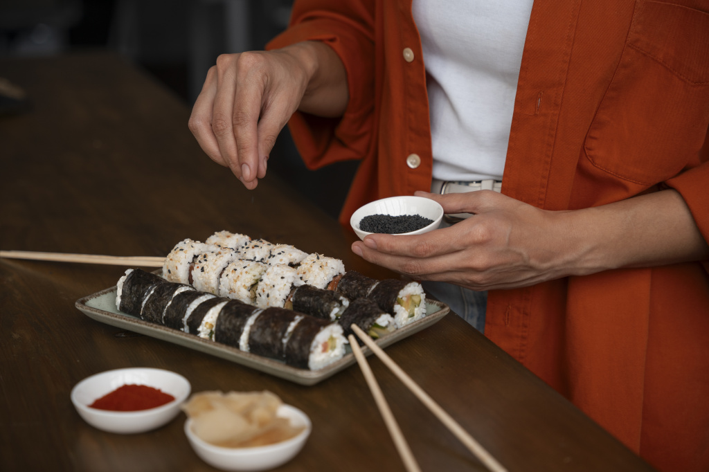 high-angle-woman-learning-make-sushi.jpg